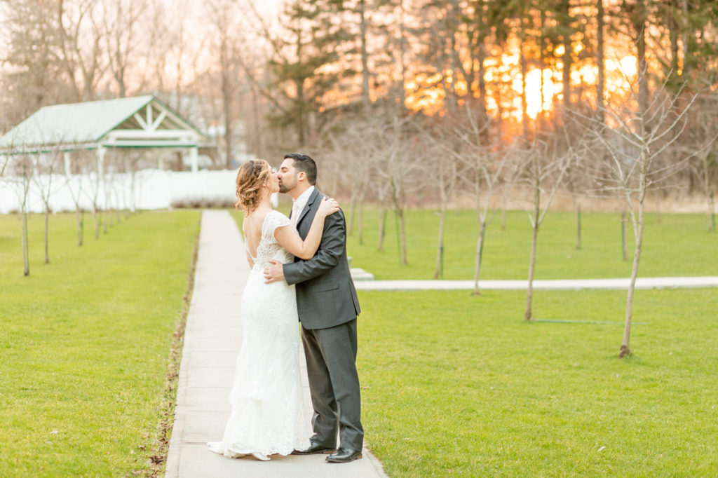 bride and groom kissing at golden hour in Upstate NY