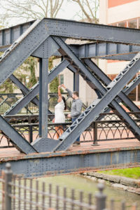 Couple dancing on a bridge together taken by a Syracuse NY Photographer