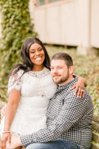 Fiance sitting on lap of significant other taken by a Syracuse NY Photographer