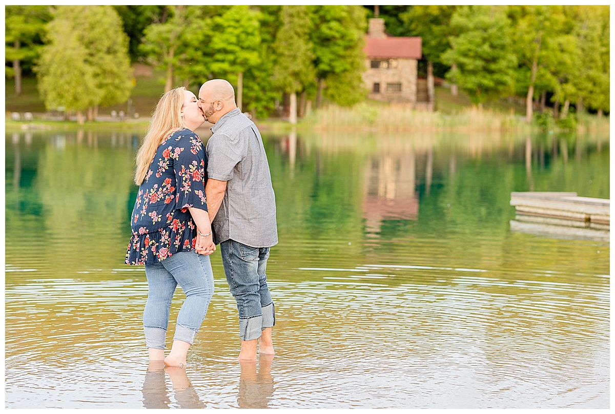 Couple kissing in the water at green lakes state park